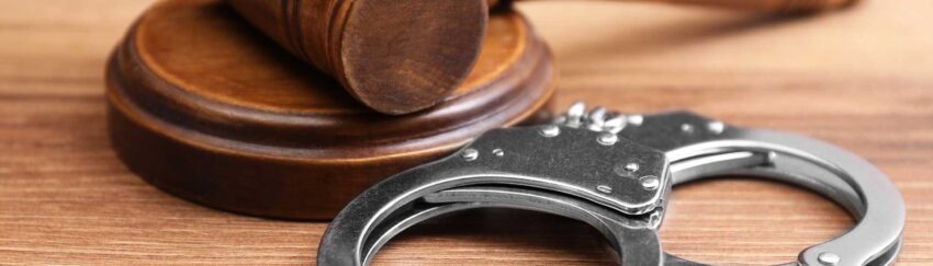 A gavel and handcuffs on a table in Greenspoint that was used in a case where the defendants had bail bonds