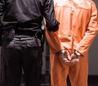Man and officer in jail needing Cheap Bail Bonds & 24 Hour Bail Bonds in Clear Lake, TX