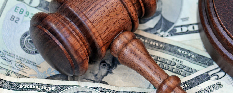 judge mallet on top of money used for bail bonds
