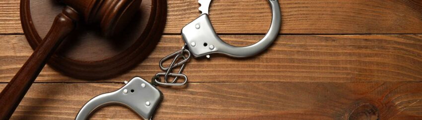 A gavel and handcuffs on a table in Greenspoint that was used in case where the defendants had a cheap bail bonds