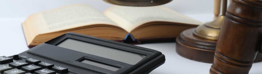 A calculator, book, and gavel that were used in a trial where the defendants had cheap bail bonds