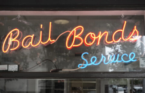Neon bail bonds service sign for 24 hour bail bonds in Trinity