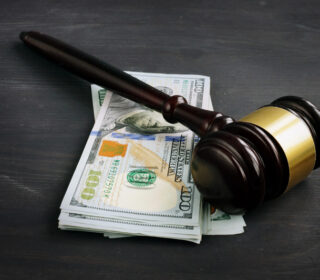 Gavel and cash for cheap bail bonds in Austin