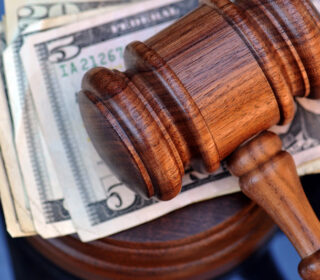 Gavel and cash for cheap bail bonds in Willowbend Area