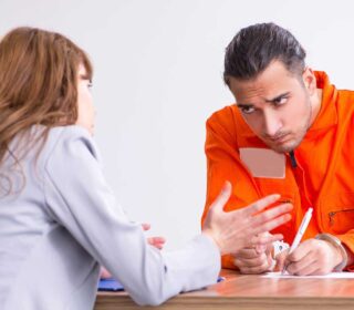 Inmate discussing bail bonds with a bail bondsman in Manchester