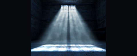 Light shining into a dark jail cell for bail bonds in Conroe, TX. We got your Bail covered.